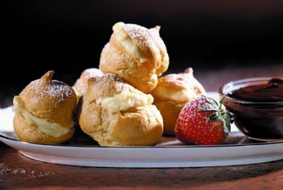 Profiteroles with Orange Cream and Chocolate Sauce